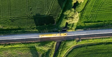 a train traveling through a lush green countryside